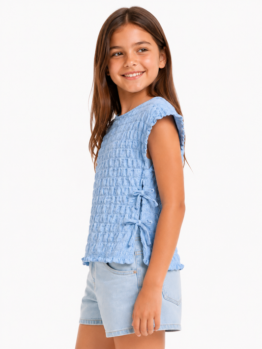 Blusa texturizada celeste / Talla 9 años