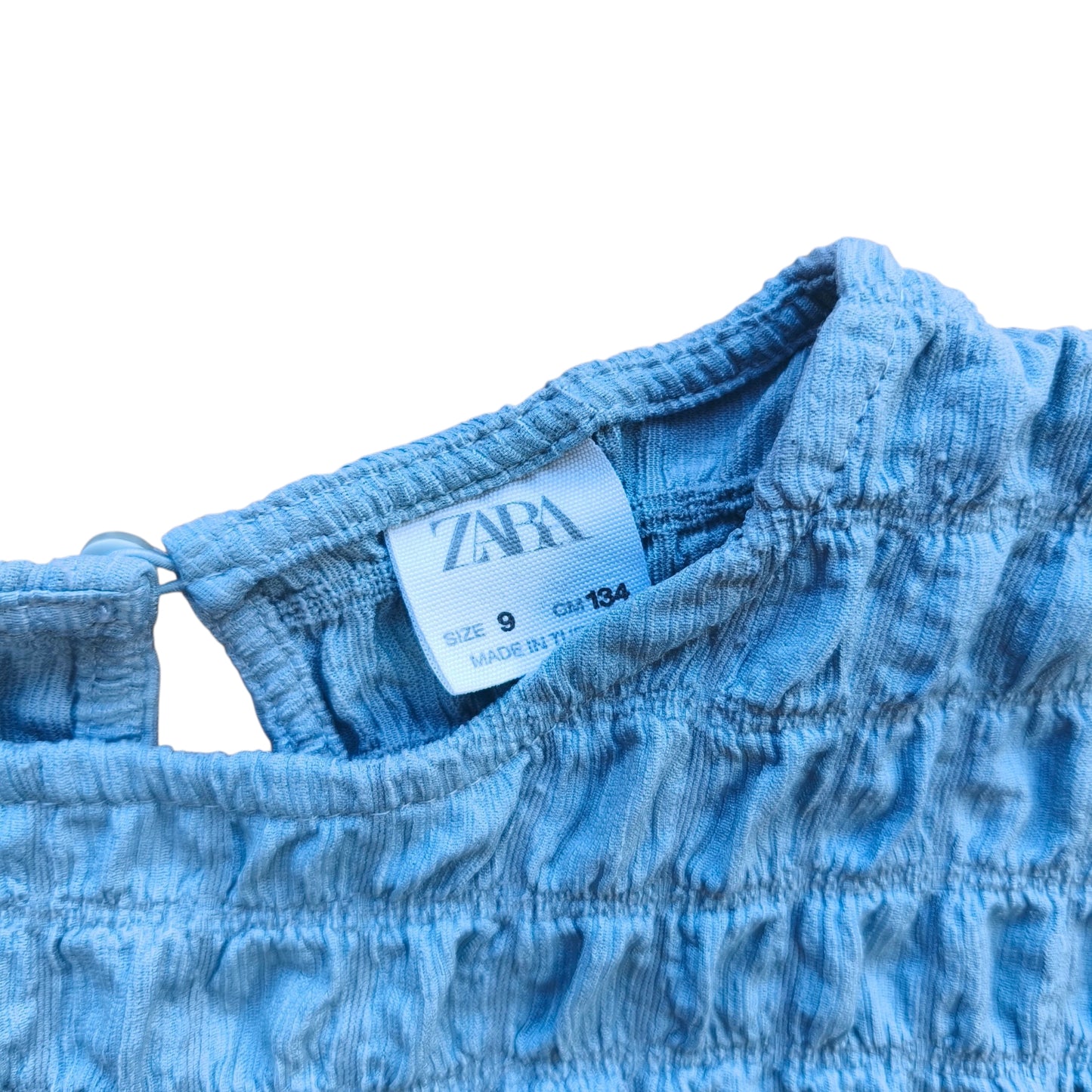 Blusa texturizada celeste / Talla 9 años