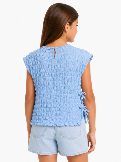 Blusa texturizada celeste / Talla 9 años